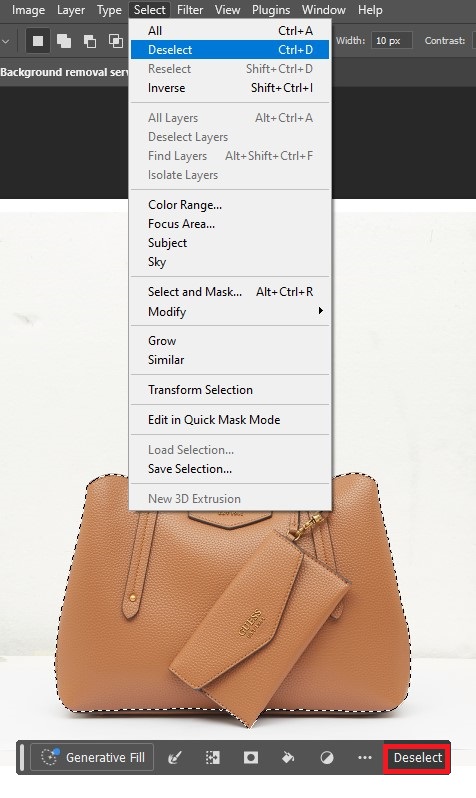 Image editor displaying a purse, with instructions to deselect an active selection from the top menu bar.