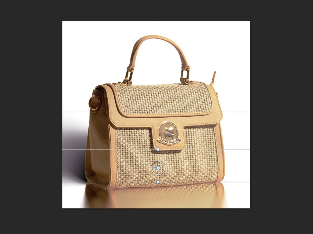 A handbag displayed in Photoshop with a blurred reflection effect applied to enhance its visual appeal.