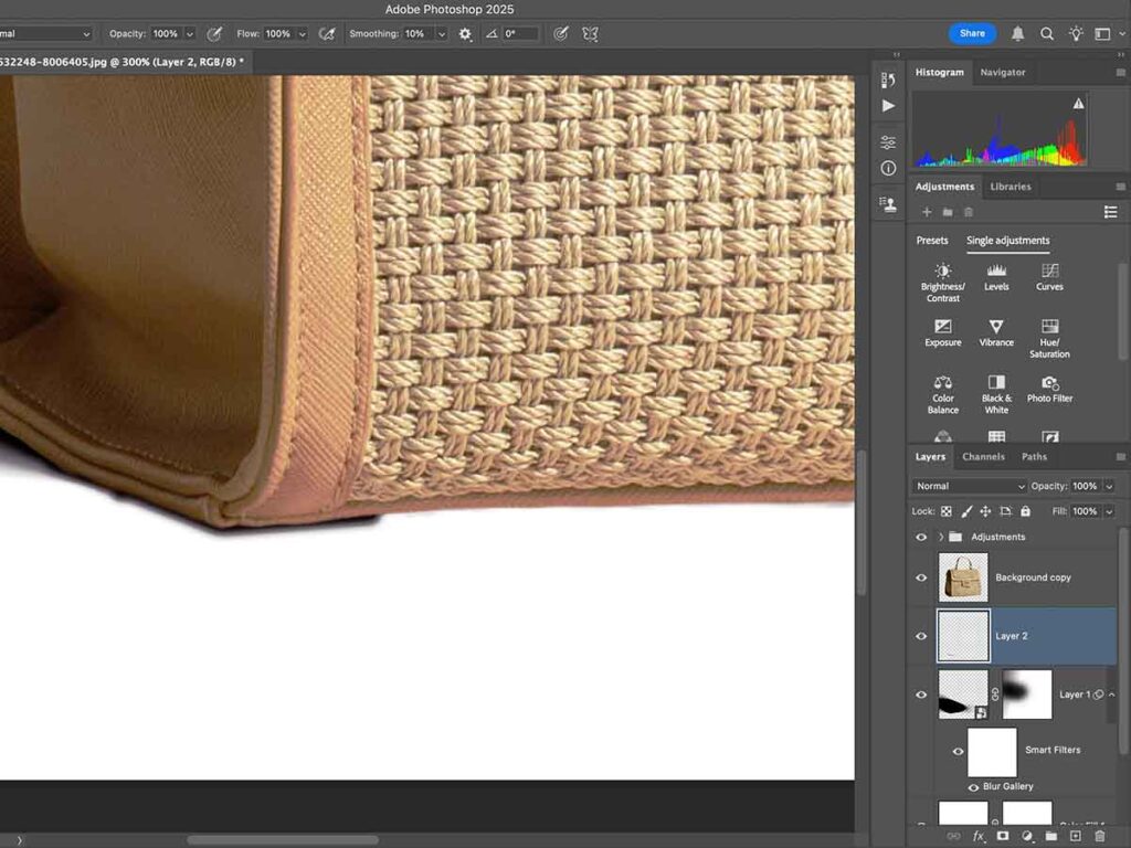 Using Shift-click to create a selection along the product bottom in Photoshop and adjusting layer opacity for depth.
