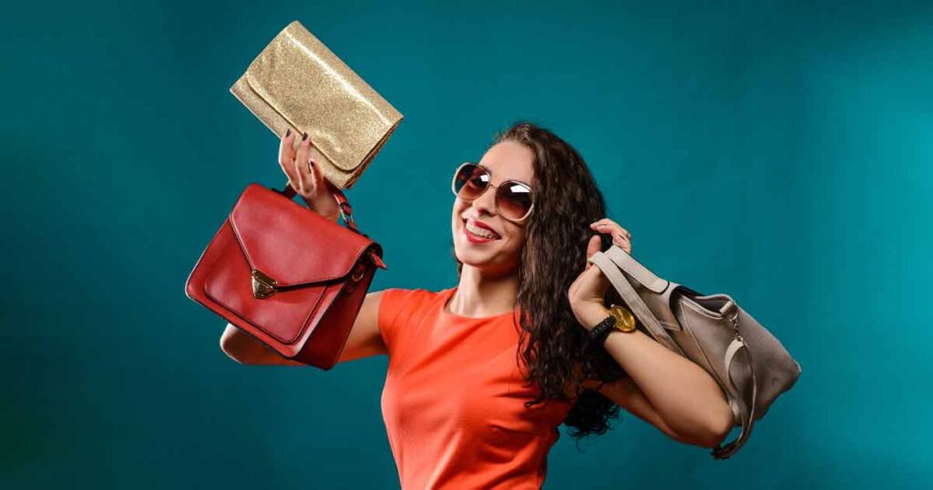 A woman in sunglasses proudly displays multiple shopping bags, showcasing a stylish and vibrant commercial photo retouching.