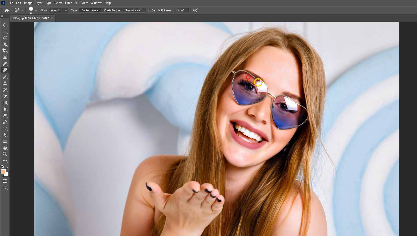 Use the clean sampled area to fix the selected glare area